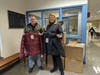 A&T Chevrolet-Subaru president Jeff Allen presenting 50 new winter coats to West Broad Street Elementary principal Susan Hadfield