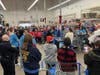Shopping Assistants and Cops receive instruction before hitting the store floor