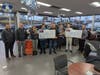 Group photo of proceeds presentation.