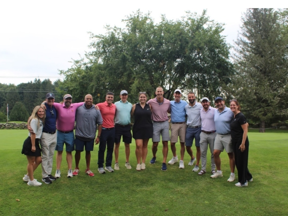 Pictured from L to R: Tori Costa, Mark Coneeny, Chris Bacon, Adam Ramos, Josh Lewin, Tim O’Brien, Jaymison Griesmer, James Bettini, Alex Tanguay, Paul Kaboub, Scott Schwalbert, David Landy, Ann-Marie Ward.
