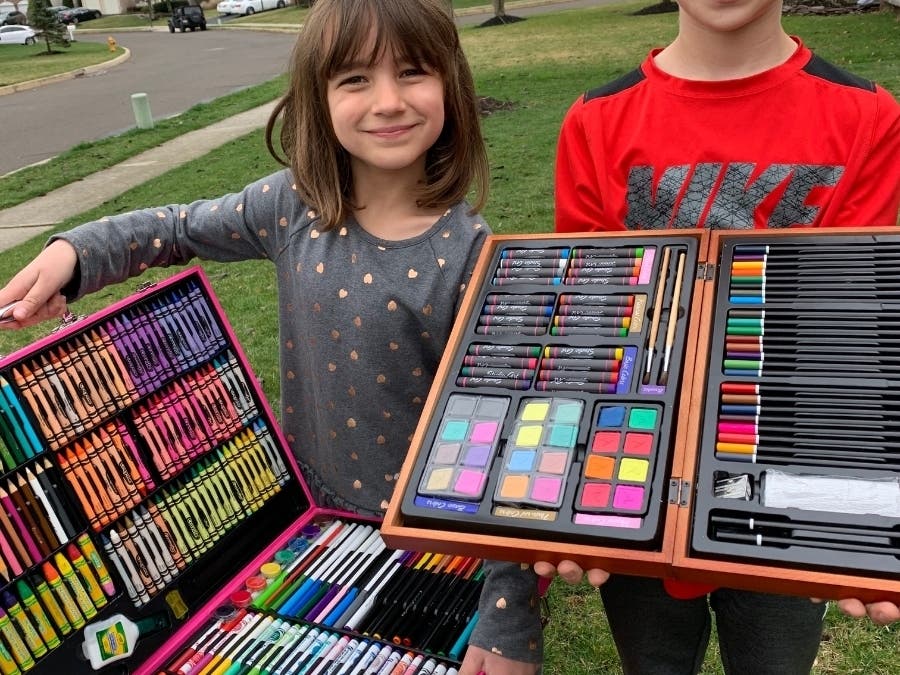 Emma and Henry Doone with their art supplies getting ready to spread some sunshine.