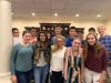 Students perform at the monthly Sunday service for residents of Middlewoods.