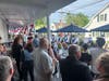 A crowd gathers to listen to the Stony Creek Fife & Drum Corps.