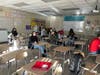 Students answer questions on Kahoot after the presentation. 