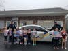 Officers from the Madison Police Department picked up donations from students at The Dance Corner