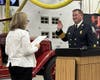 Simsbury’s Town Clerk Trish Munroe swearing in the new Fire Chief Todd Myers. Myers follows his grandfather, Stanley, and his father, Ken, as Simsbury Volunteer Fire Company members. 