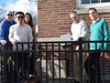 (Left to Right): Management staff members Brian Daly, Andy Ng, Susan Morton, Mark Elsasser and Greg Hatzisavvas gather to return the updated time capsule to its original location.