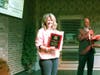 Shelly Malizola, owner of Allure Designs Salon + Boutique accepting the The Dom Lentini Downtown Business of the Year award at the 2024 MainStreet Libertyville Annual Meeting.
