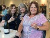 Friends gathered at the wine bar at The Joyful Gourmet during First Friday in downtown Libertyville. 