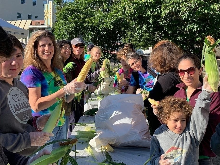 Volunteers helping at last summer's Annual Corn Roast