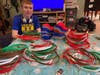 Teacher Steve Dembo transforms his basement into a workshop to create shields for healthcare workers (pictured here: Dembo's son Aiden)