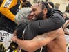 Kenny Holmes embraces his mother, Sarah, after the Steel City Yellow Jackets won the ABA Championship.