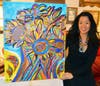 Lisa Mee with one of her popular paintings.