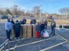 A group of volunteers near boxes of food donations during the 2020 donation event. 