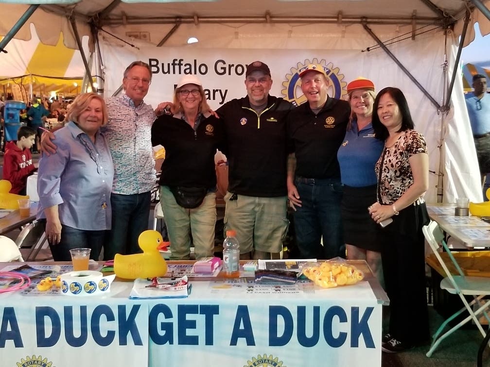 Buffalo Grove Rotarians are pictured at a previous BG Days at the Rotary booth where ducks tickets will be sold again this year. Ducks can also be purchased online at bgrotary.org. 