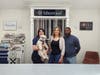 Left to right: Morgan Gard (designer), Winston the Showroom Pup, and Camille and Marcus Johnson, co-founders and owners of Lotus Home Improvement and Great Lakes Building. 