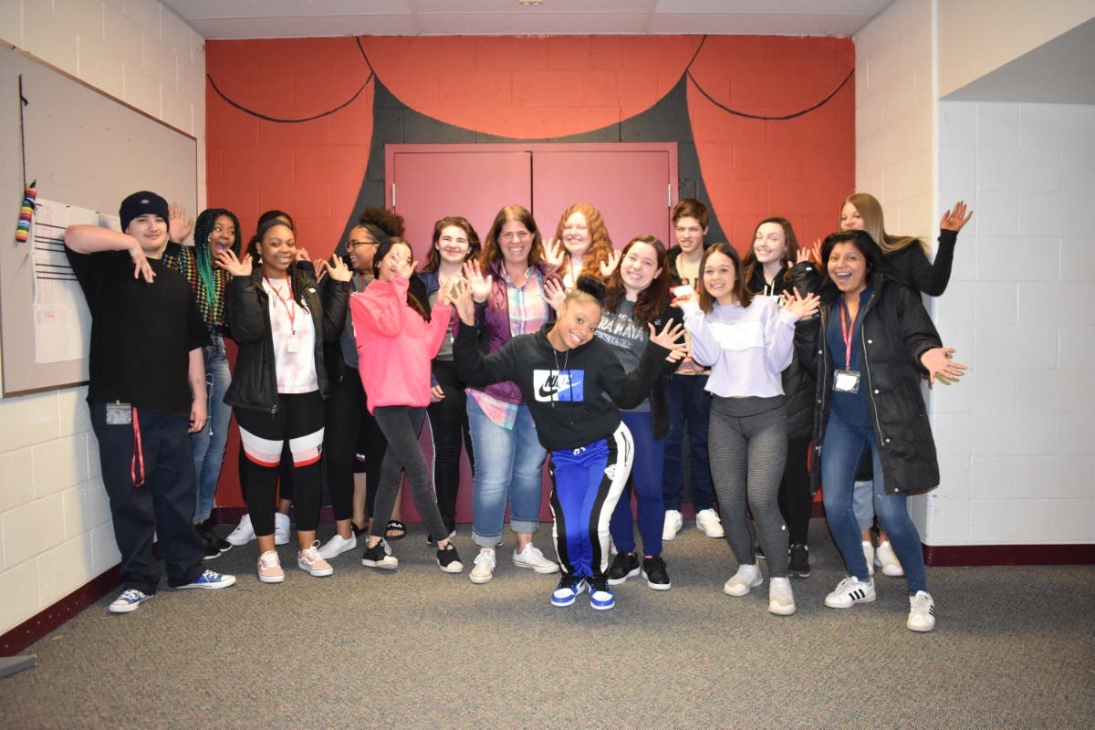 Students in Ms. Ann Fredrickson's class react to the announcement that she has been named Teacher of the Year