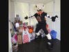 Arizona Rattlers mascot, Stryker, stands in a PODS Phoenix container filled with toys for Hope & A Future