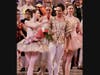 Prima ballerina Tiler Peck hands a single rose to her real-life fiancé and onstage partner, Roman Mejia 