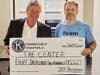 Matt Clarage (R) of the Orland Park Kiwanis Club presents executive director Dave Sanders with a check of $8,200 for The Center's new boiler.