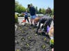 Members of the Bethlehem Township Community Center help plant marigolds. Traditions of Hanover donated the flowers to honor the memory of Allison Perno. 