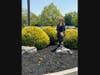 Bethlehem Township Community Center employee Cathy Perno smiles at the flourishing marigolds donated by Traditions of Hanover to honor the memory of her daughter, Allison Perno. 