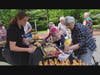 Traditions of Hanover resident Loretta Lopez samples one of the dips prepared by the dining department from the herbs that were available to create their own kitchen garden. 