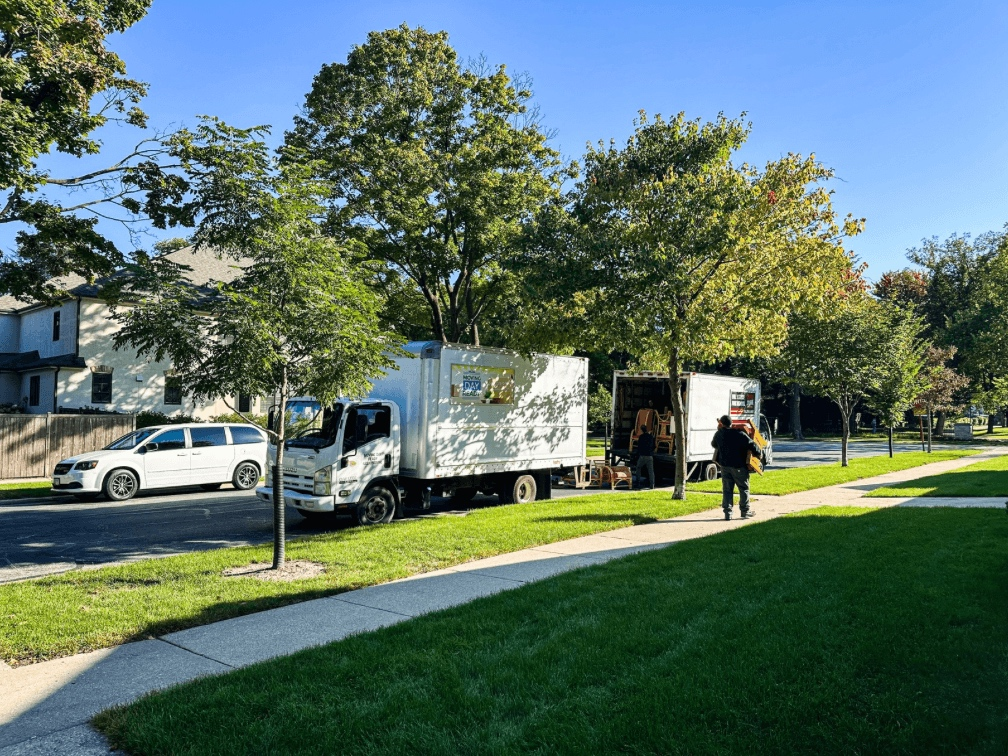 Day two with Moving Day Ready and Metro Junk Removal: a few truckloads of furniture, books, and art headed for donation, while the sorting and packing continue inside.