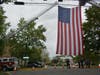 The town's fire companies proudly hung a huge American Flag in front of the entrance to Darien Town Hall to honor the new police chief.