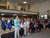 The audience gives Darien's new police chief a standing ovation.