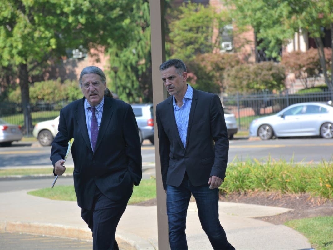 Attorney Norm Pattis, left, and Fotis Dulos on their way to a recent court appearance in Stamford.
