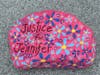 One of the "Justice for Jennifer" rocks in New Canaan, painted by members of a Facebook group and others who want to ensure she is not forgotten. This one is at Town Hall.