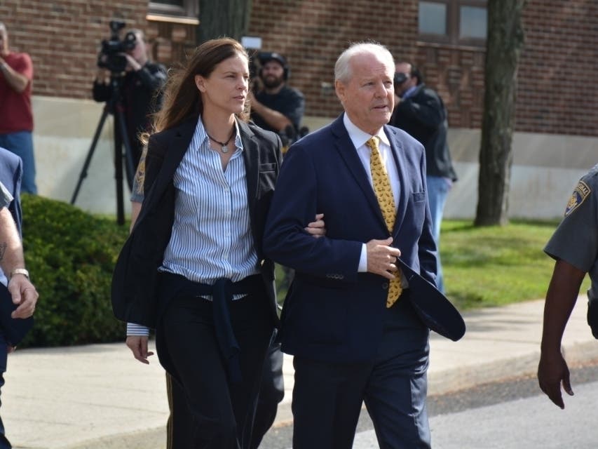 Michelle Troconis, left, and her father, Dr. Carlos Troconis, leaving Norwalk Superior Court last summer.