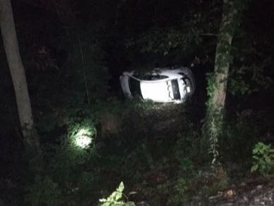 A woman was able to walk away from this Saturday morning crash on the Merritt Parkway in Norwalk, in which the vehicle plunged 60 feet down an embankment into the Norwalk River, according to fire officials. 