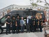 Norwalk Mayor Harry Rilling, light blue blazer; Norwalk Housing Authority Executive Director Adam Bovilsky, dark blue blazer; and members of the Norwalk police Force in front of the new community engagement van.