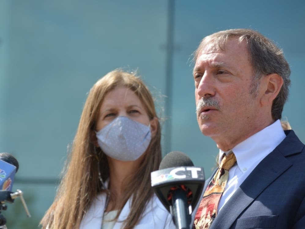Michelle Troconis, left, and attorney Jon Schoenhorn after an August court hearing in Stamford.
