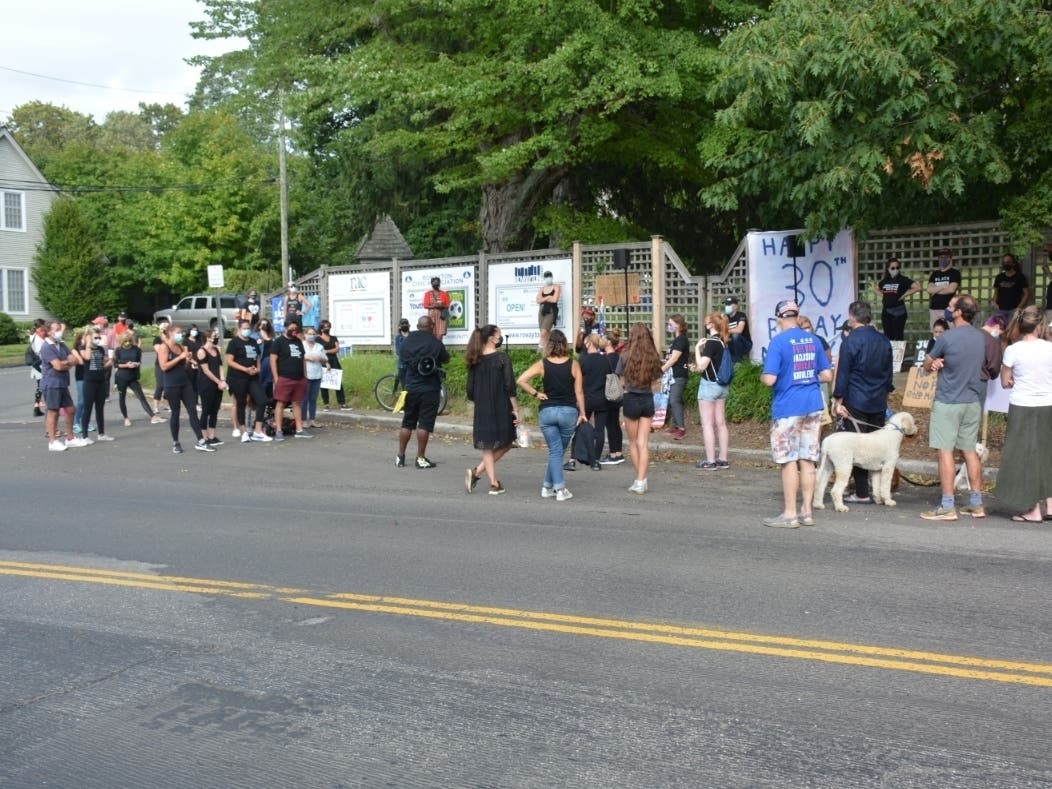 A rally last summer in support of a Black Lives Matter sign at the Old School Fence on Rowayton Avenue.