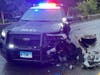 A Naugatuck police cruiser was heavily damaged Friday when fleeing suspects crashed into it on Route 8.