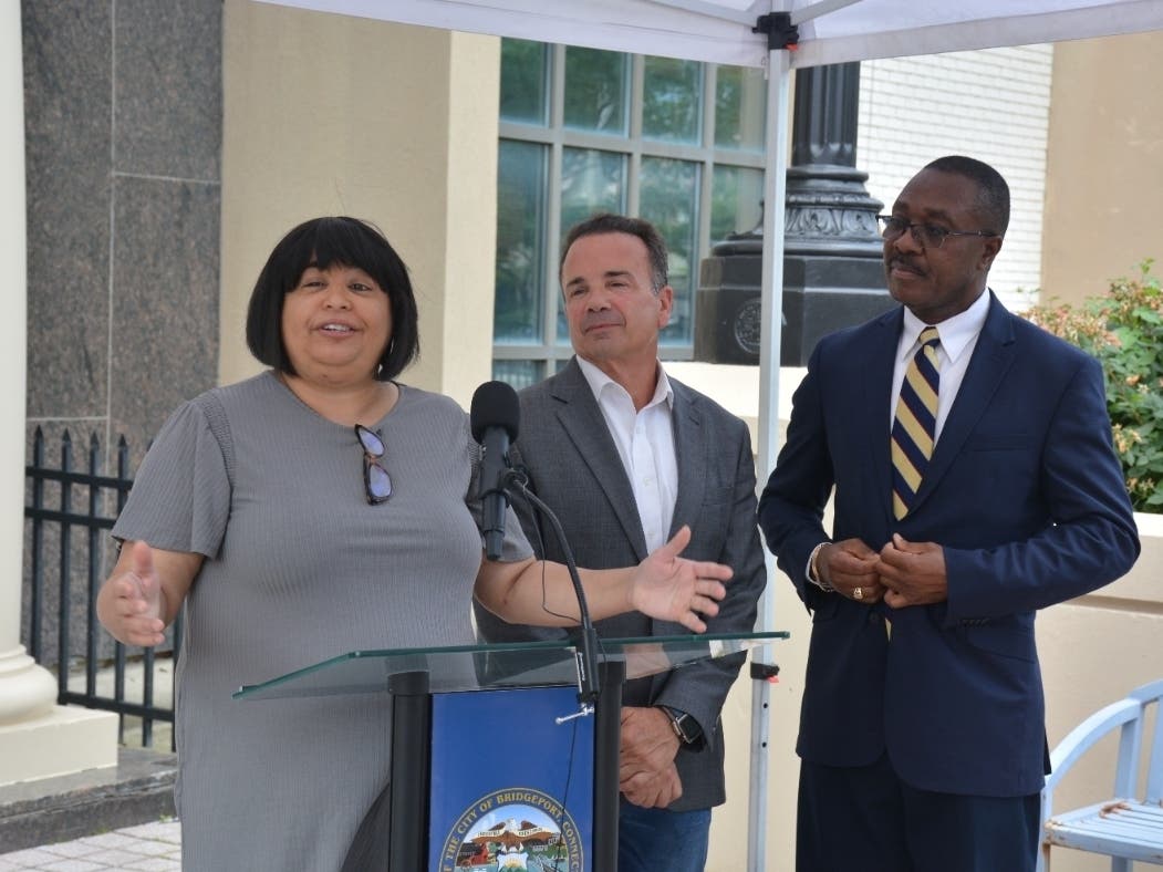 News conference announcing "Home Bridgeport," a new first-time homebuyer down payment and closing cost assistance program. From left, Building Neighborhoods Together CEO Doris Latorre; Bridgeport Mayor Joseph Ganim; and local realtor C. Obiora Nkwo.