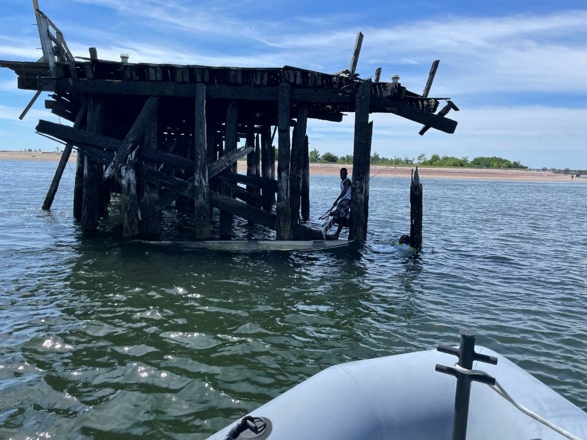 Two men were pulled from the waters off Bridgeport Sunday morning after their canoe capsized, according to Bridgeport police.