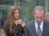 Michelle Troconis, left, and her attorney, Jon Schoenhorn, in front of Stamford Superior Court, Oct. 18, 2022.