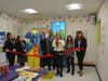 Fairfield First Selectwoman Brenda Kupchick cuts a ribbon during the one-year anniversary celebration at The Learning Experience.