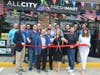 First Selectwoman Brenda Kupchick cuts the ribbon at All City Fresh Mart in Fairfield. She is joined by the owners, the Sedda family, and officials.