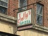 The iconic sign of Sally's Apizza in New Haven.