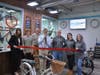 Cycl Crft held a ribbon-cutting ceremony Thursday with Fairfield Economic Development Director Mark Barnhart and Chamber of Commerce President Beverly Balaz. Barnhart, with scissors, is flanked by owner Jeremy Brittain, right, and mechanic Mike Conlan. 