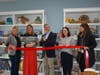 Mark Barnhart, Fairfield's Director of Community & Economic Development, cuts the ribbon at the recently opened Ocean Blu Boutique on Black Rock Turnpike.