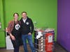 Monica and Jay Dulski, owners of Children's Art Classes in Fairfield, next to their new pottery kiln.