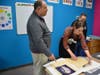 Fairfield First Selectman Bill Gerber discusses art with the Dulskis at Children's Art Classes on Black Rock Turnpike.