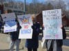 Protesters along the Ruth Steinkraus Cohen Bridge on Route 1 in downtown Westport during Saturday's No Kings rally.