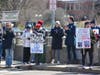 Protesters along the Ruth Steinkraus Cohen Bridge on Route 1 in downtown Westport during Saturday's No Kings rally.